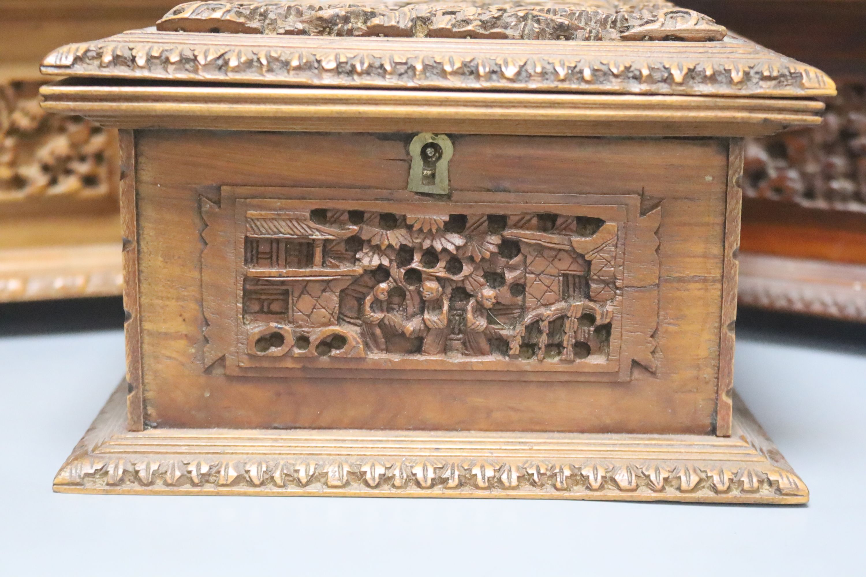 Three 19th century Chinese carved sandalwood caskets, longest 19cm